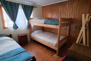 Postel nebo postele na pokoji v ubytování Algarrobo Cabaña a 2 cuadras Playa El Canelo+Wifi