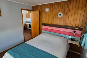 Postel nebo postele na pokoji v ubytování Algarrobo Cabaña a 2 cuadras Playa El Canelo+Wifi
