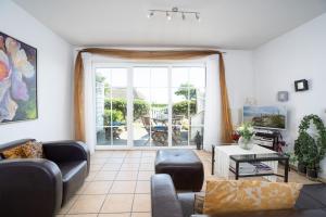 Posezení v ubytování Strand Domizil Wohnung 2