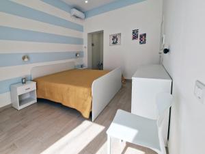 Postel nebo postele na pokoji v ubytování Casa Mo'