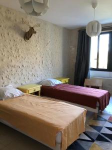 Postel nebo postele na pokoji v ubytování La grange au puits + 12 fotografií