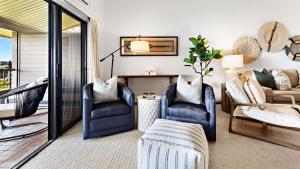 a living room with two chairs and a couch at Kapalua Ridge Villa 1624 in Kapalua