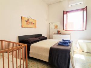 Postel nebo postele na pokoji v ubytování CASA AMMARE - Beach House - Ostuni