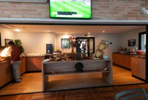 TV a/nebo společenská místnost v ubytování EZ Moema Hotel