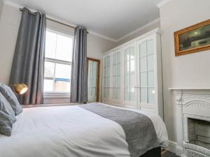 Postel nebo postele na pokoji v ubytování Rydal Cottage