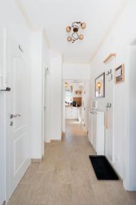 a hallway of a home with white walls and a ceiling at Ferienhaus Purgar in Kammern im Liesingtal +30 photos