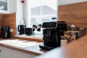 a coffee maker sitting on a counter in a kitchen at Ferienhaus Purgar in Kammern im Liesingtal