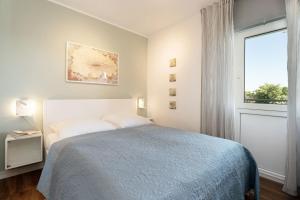 Postel nebo postele na pokoji v ubytování Seeschlösschen Wohnung 524