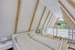 a bedroom with a bed and a large window at UNA RESORT in Bosanska Krupa +49 photos