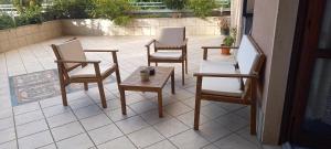 a group of chairs and a table on a patio at Notti di luna in Potenza
