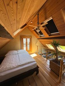 a bedroom with a bed and a vaulted ceiling at Ferienhaus Romantica in Bruttig-Fankel für 2 Personen in Bruttig-Fankel