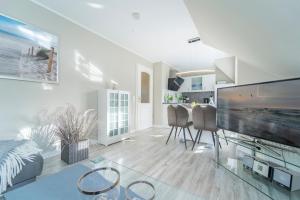 TV a/nebo společenská místnost v ubytování Haus Pegasus Glücksbringer + 33 fotografií