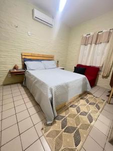 Ένα ή περισσότερα κρεβάτια σε δωμάτιο στο Paraíso jeri