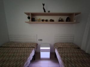 Postel nebo postele na pokoji v ubytování Cala del Pi