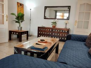 a living room with a couch and a coffee table at Apartment Marbella Centro in Marbella
