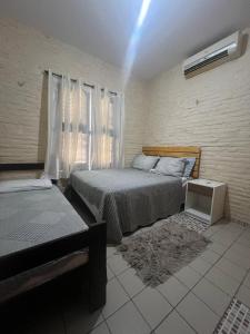 Ένα ή περισσότερα κρεβάτια σε δωμάτιο στο Paraíso jeri +6 φωτογραφίες