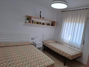 Postel nebo postele na pokoji v ubytování Cala del Pi + 37 fotografií