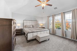 a bedroom with a bed and a ceiling fan at Modern Allen Prairie Retreat in Allen