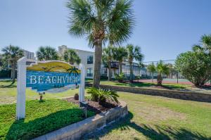 a sign for the beach entry to a resort at Beach on a Budget by Gulf Coast Getaways in Navarre