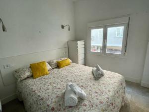 a bedroom with a bed with towels on it at Casthotels Leblon in El Arenal +19 photos