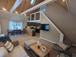 a living room with a couch and a table at Walking Distance to the Beach Cabin with AC in Arrowhead Lake