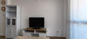 a television sitting on a table in a room at Enebrales 423 in Punta Umbría