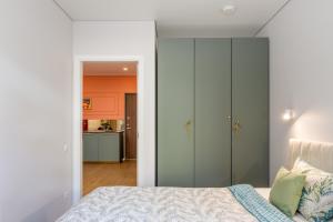 Postel nebo postele na pokoji v ubytování Vanagupe FRIDA apartments & Pusynas SPA