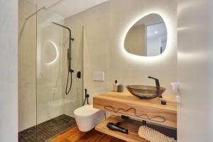 a bathroom with a vessel sink and a shower at Penthouse in El Cotillo in Cotillo +31 photos