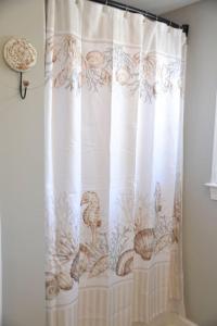 a shower curtain with ducks on it in a bathroom at 4BR Historic Home Private Dock Fishing in Davis