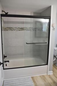 a glass door with a handle in a room at 4BR Historic Home Private Dock Fishing in Davis +19 photos