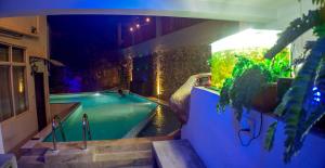 a swimming pool in a building with a swimming pool at Villa Baywatch, Rumassala in Unawatuna