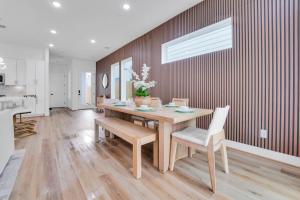 a dining room with a wooden table and chairs at Classy 4BD 3.5BA with Soak Tub Backyard and Game Room in Houston
