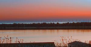 a body of water with a sunset in the background at 95C Sunset View Port Haverigg Marina Village in Millom