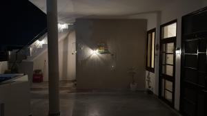 a hallway with a door with a fire truck on the wall at Comfort stay in Beās