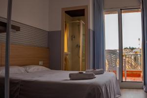 Postel nebo postele na pokoji v ubytování Can Setmanes by CozyCatalonia