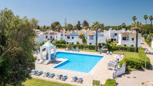 an aerial view of a pool at a resort at Quinta Velha Oasis, Pool Resort in Cabanas de Tavira