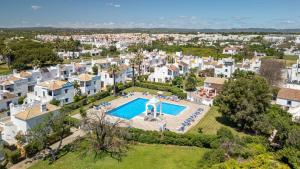 an aerial view of a villa with a swimming pool at Quinta Velha Oasis, Pool Resort in Cabanas de Tavira +30 photos
