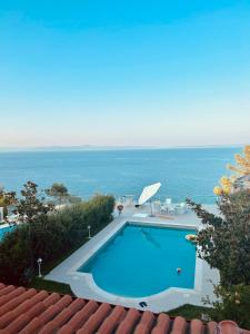 a swimming pool with a view of the ocean at Villa Blue Lagoon in Afitos