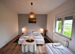 Postel nebo postele na pokoji v ubytování Guesthouse Obitelj Paulic