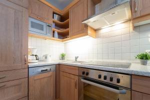 Kuchyň nebo kuchyňský kout v ubytování Sonnenpark- Wohnung 5