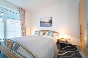 Postel nebo postele na pokoji v ubytování Sonnenpark- Wohnung 5