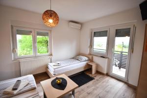 Postel nebo postele na pokoji v ubytování Guesthouse Obitelj Paulic