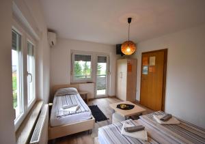 Postel nebo postele na pokoji v ubytování Guesthouse Obitelj Paulic