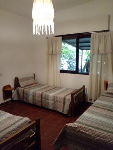 Ένα ή περισσότερα κρεβάτια σε δωμάτιο στο La casa de Silvia - Tanti SOLO FAMILIAS