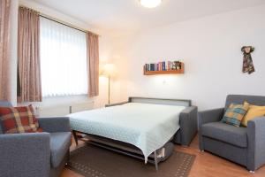Posezení v ubytování Ferienwohnung Ostseebutt mit Terrasse im Kaiserhof 2 + 14 fotografií