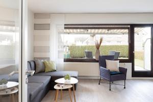 a living room with a couch and a table at Seestern in Grömitz