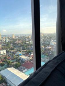 a view of a city from a window in a building at Mabolo Garden Flats 2312 in Cebu City