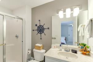 a bathroom with a sink and a large mirror at Private Dock and 4 Decks Lake Ozark Retreat! in Gravois Mills +36 photos