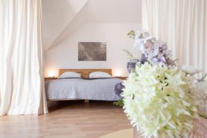 Postel nebo postele na pokoji v ubytování Kaiserhof 42-44 Dünenrose