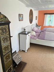 a bedroom with a bed and a dresser in it at Chalupa v Cíšařským in Golčŭv Jeníkov +4 photos